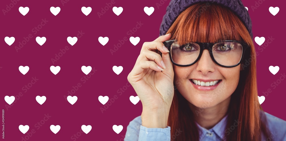 Composite image of smiling hipster woman looking at camera