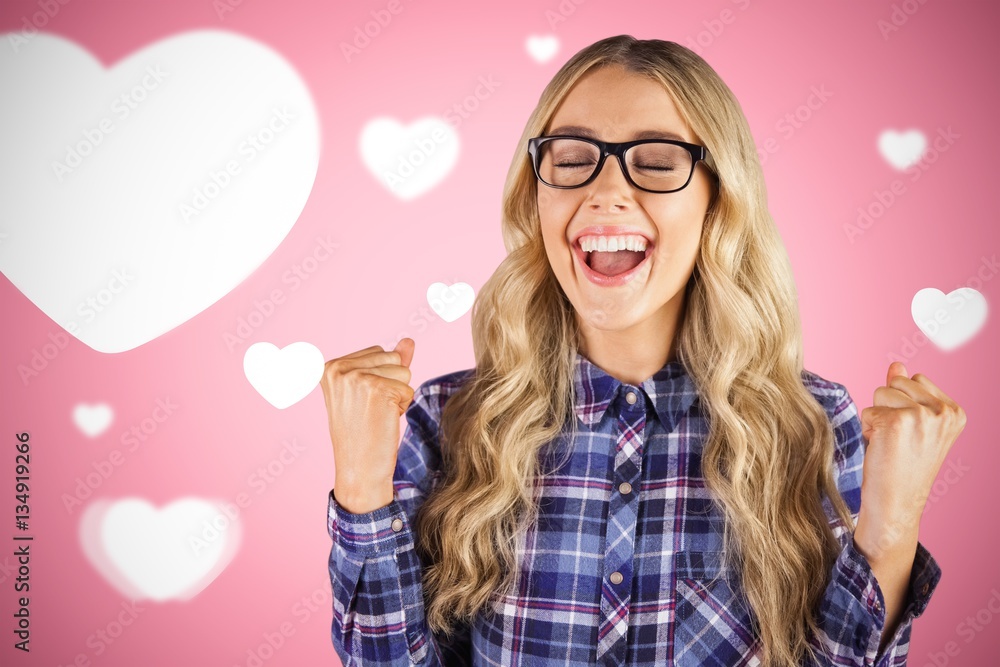 Composite image of gorgeous blonde hipster celebrating success