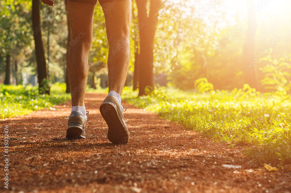 Man preparing for a run in park at spring morning. Healthy lifes