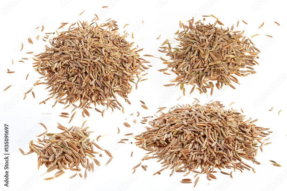 Cumin seeds or caraway isolated on white