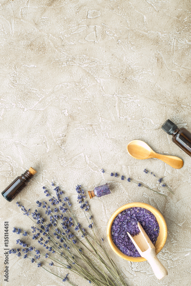 Essential oil and lavender salt with flowers top view