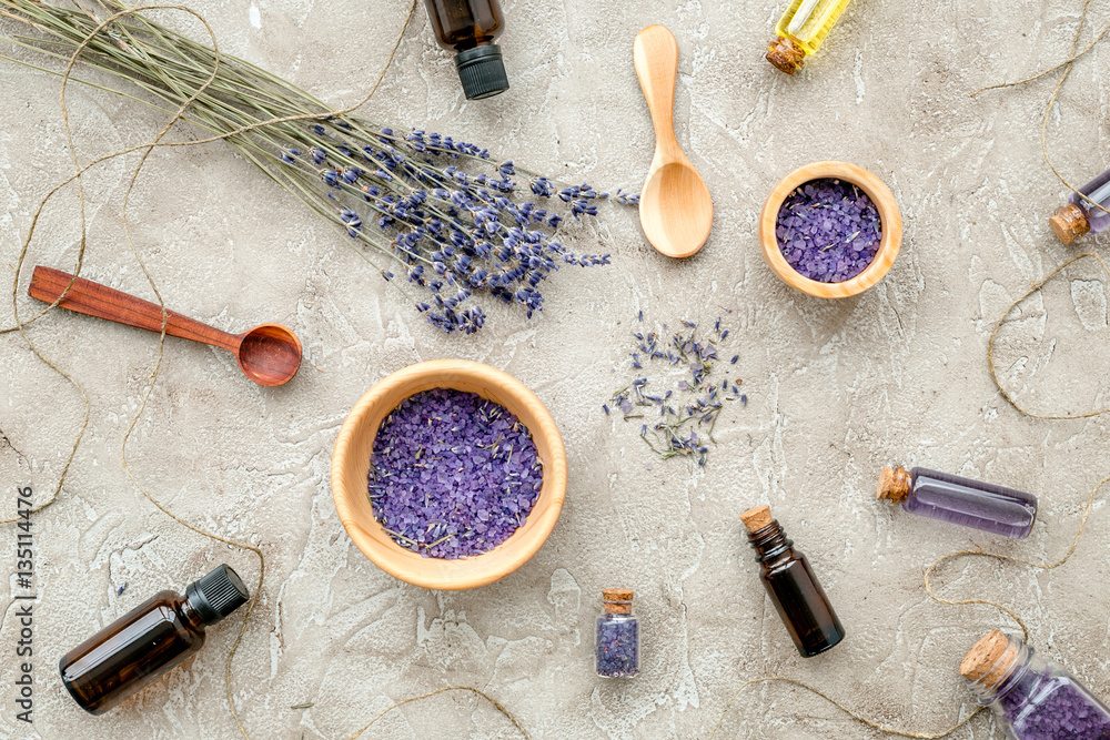 Essential oil and lavender salt with flowers top view