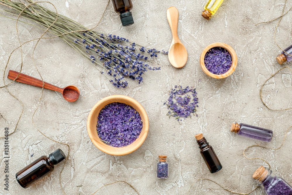 Essential oil and lavender salt with flowers top view