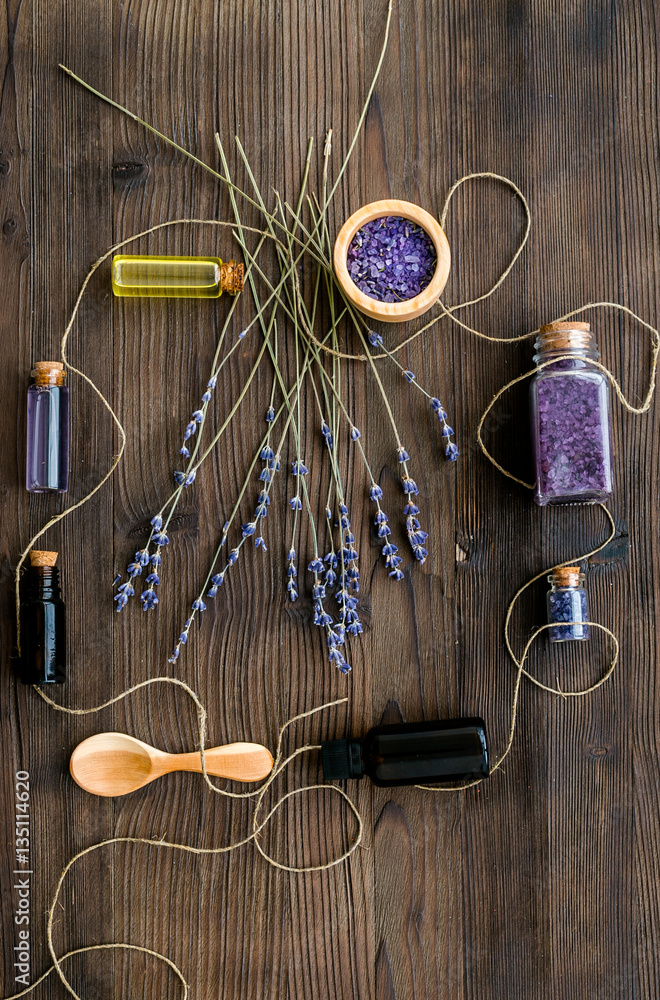 organic cosmetics with lavender on wooden background top view