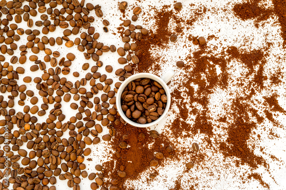 coffee beans on gray with coffe cup table top view