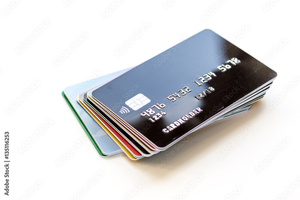 pile of credit cards on white background