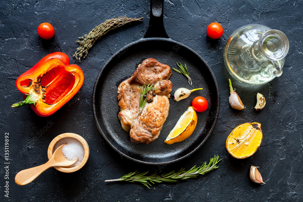 concept cooked steak on dark background top view