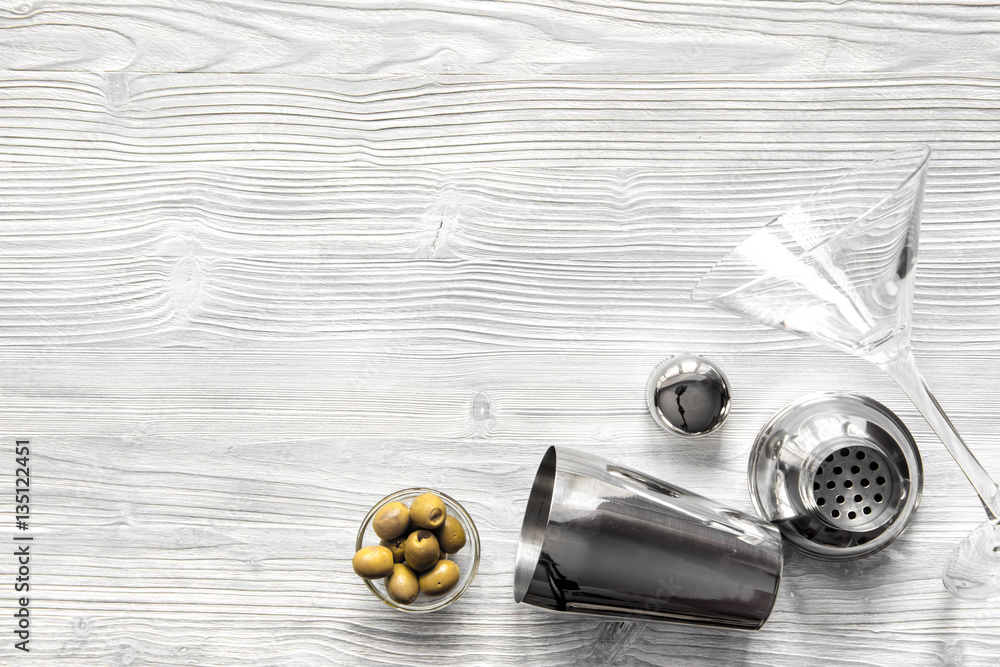 martini and shaker top view of wooden background