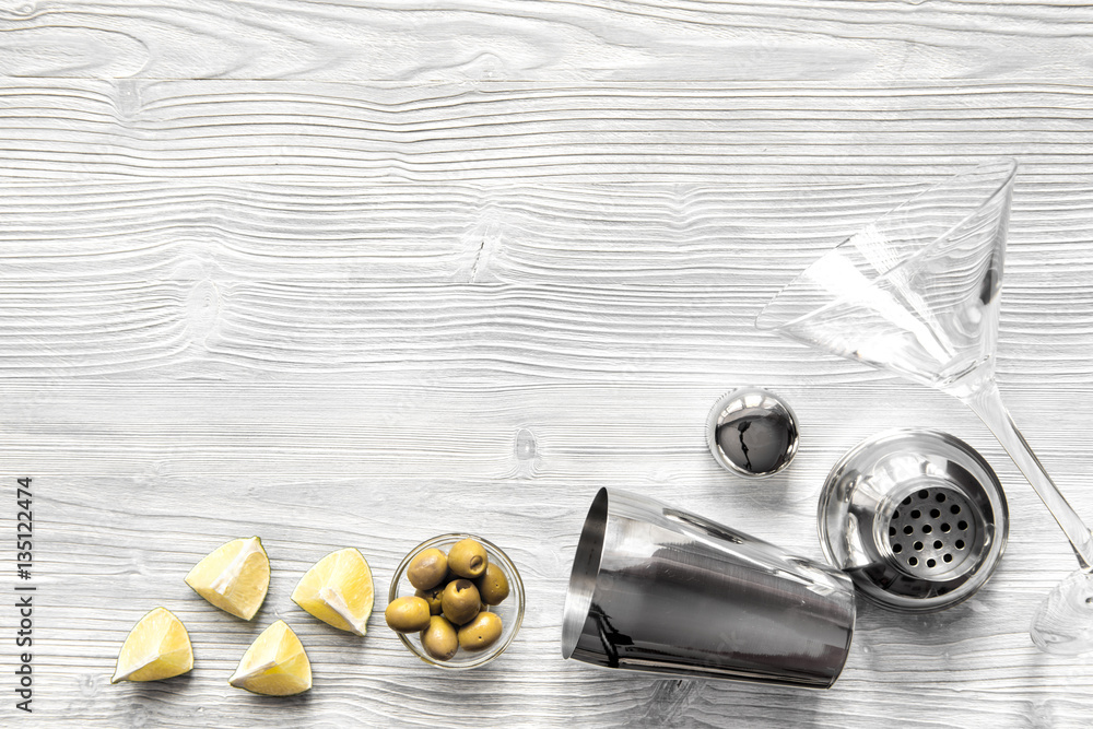 martini and shaker top view of wooden background