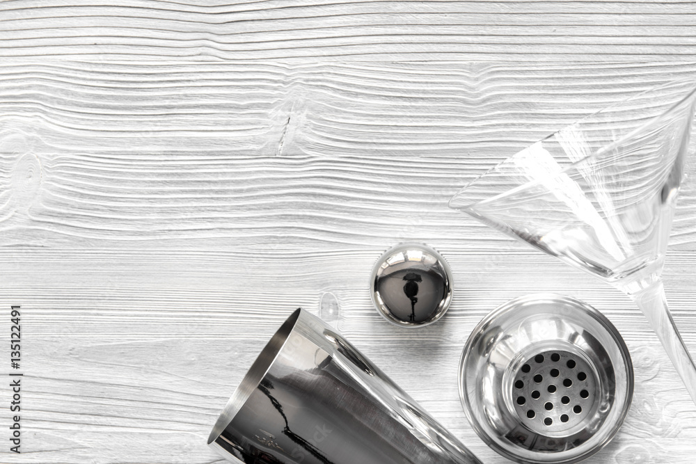 martini and shaker top view of wooden background