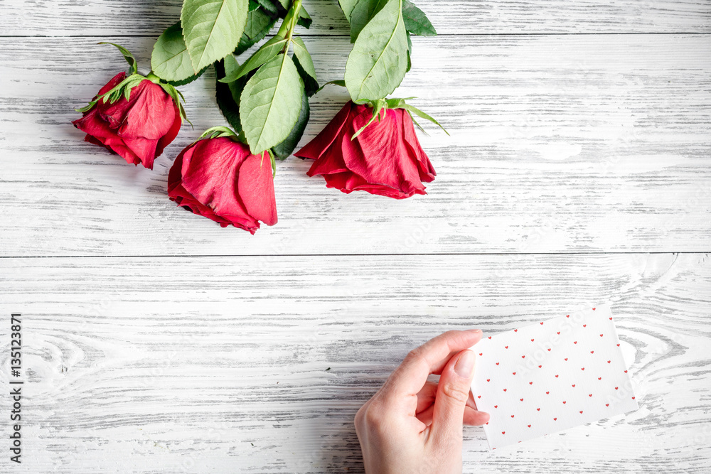 concept Valentines Day with flower wooden background top view