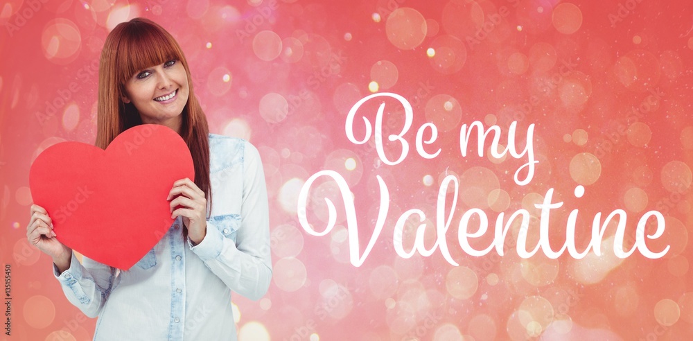 Composite image of attractive hipster woman behind a red heart