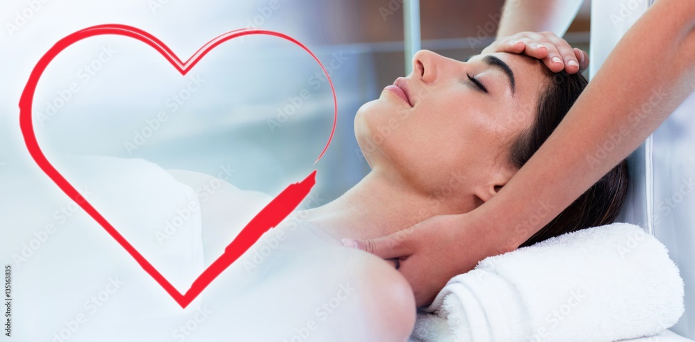 Composite image of head massage on woman with love heart