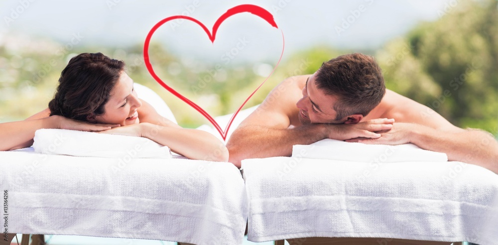 Composite image of a couple receiving a massage