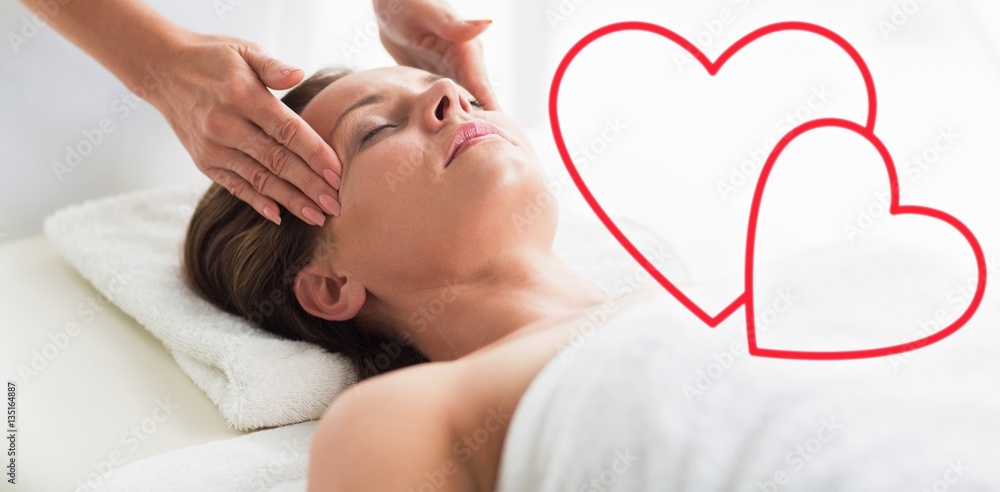 Composite image of forehead massage woman love hearts