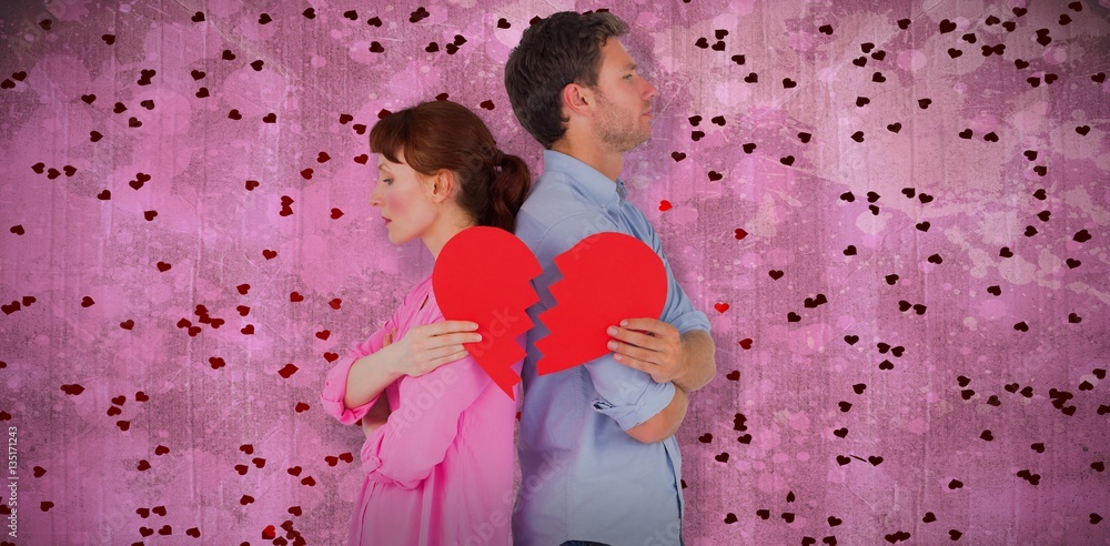 Composite image of couple holding a broken heart