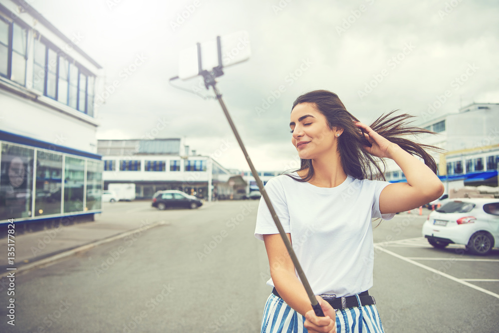 Gorgeous woman taking a self portrait