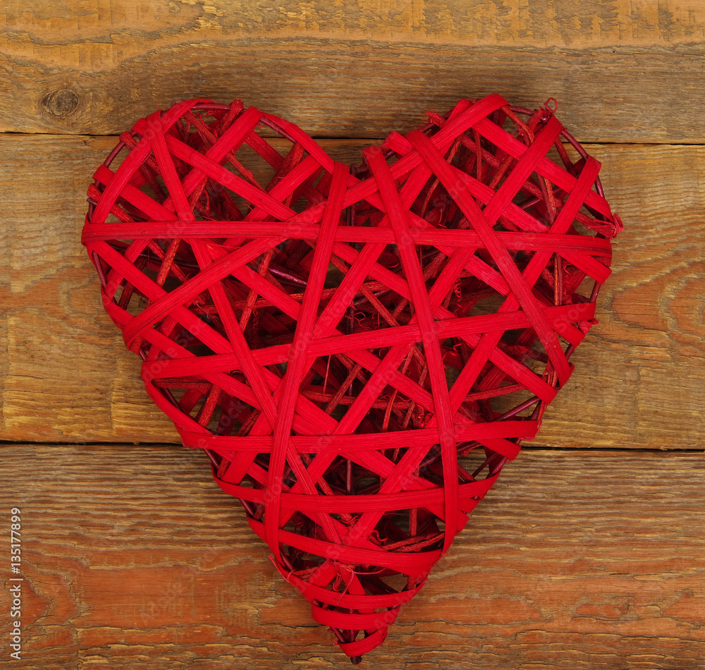 Red heart on of wood