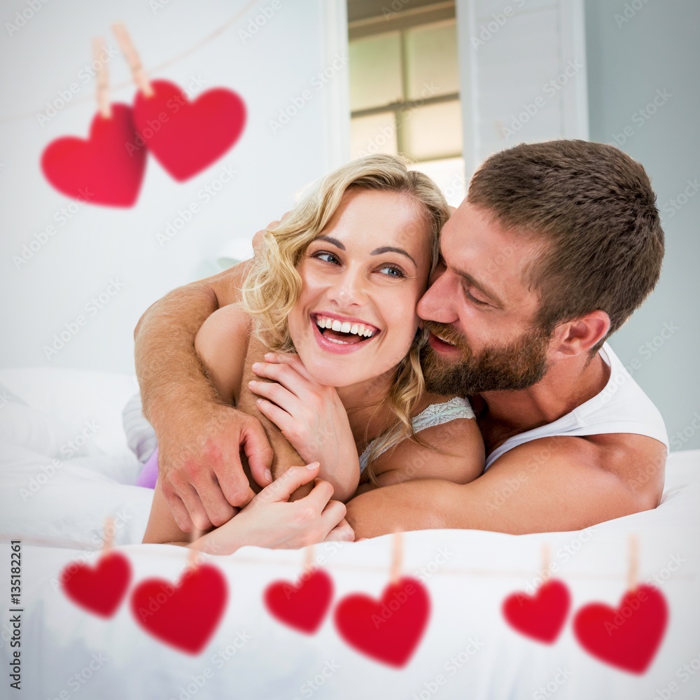 Composite image of hearts hanging on a line