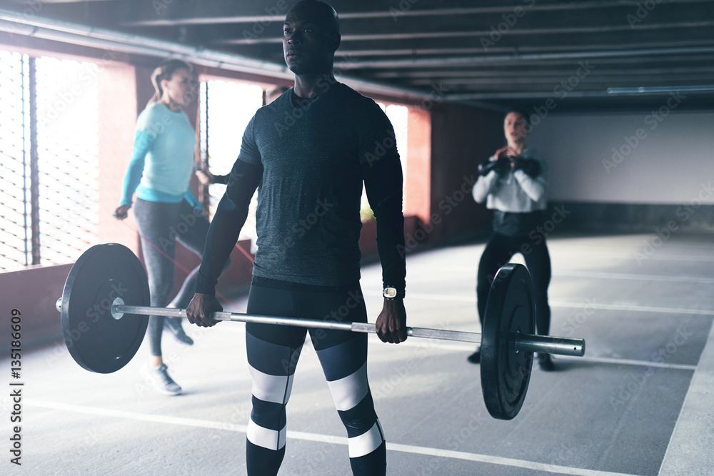 Muscular African American man doing crossfit