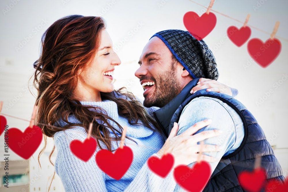 Composite image of hearts hanging on a line