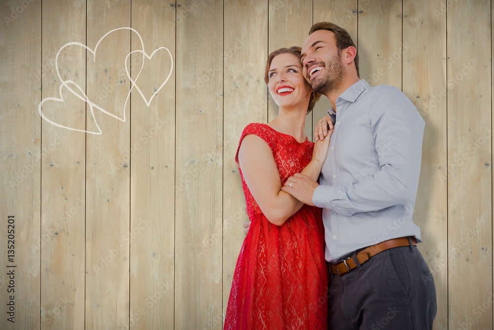 Composite image of young couple embracing each other