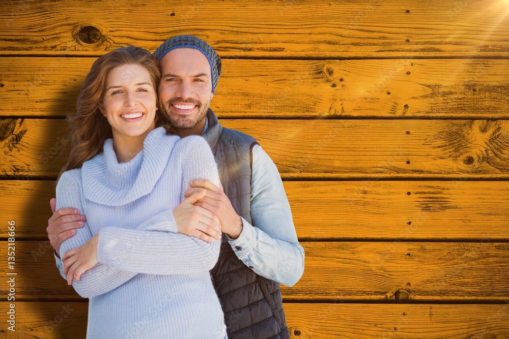 Composite image of happy couple embracing each other