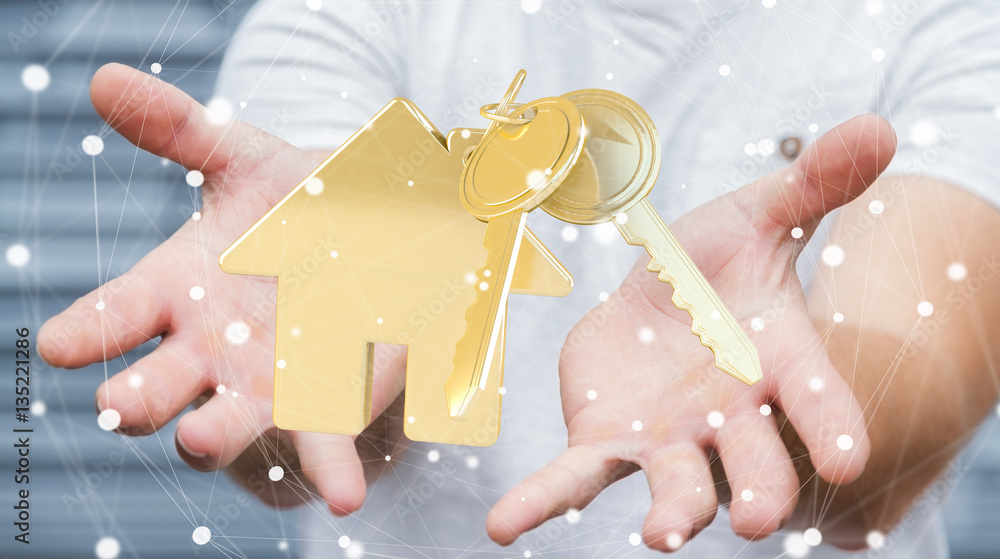 Businessman holding key with house keyring in his hand 3D render