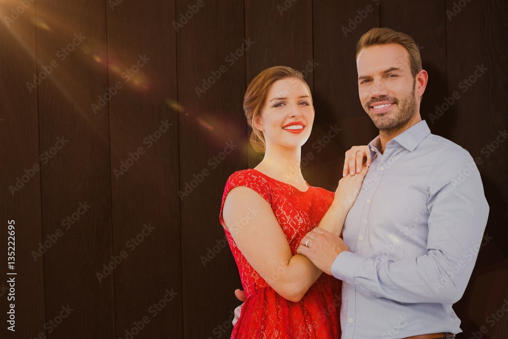 Composite image of portrait of young couple embracing each other