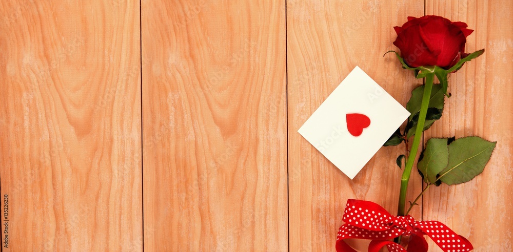 red heart envelope and a red rose