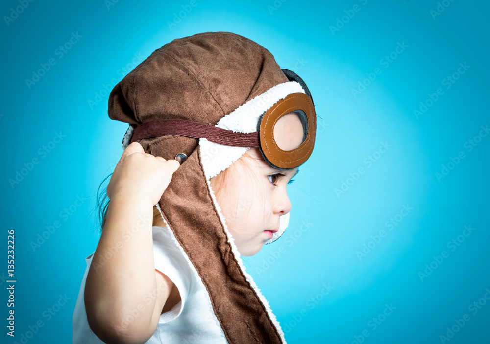 Toddler girl playing in pilot glasses