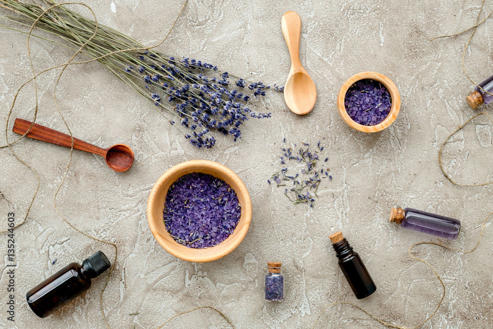 Essential oil and lavender salt with flowers top view