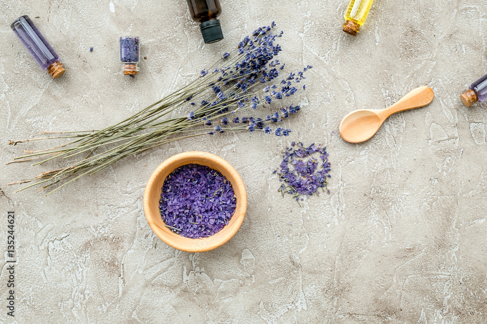 Essential oil and lavender salt with flowers top view