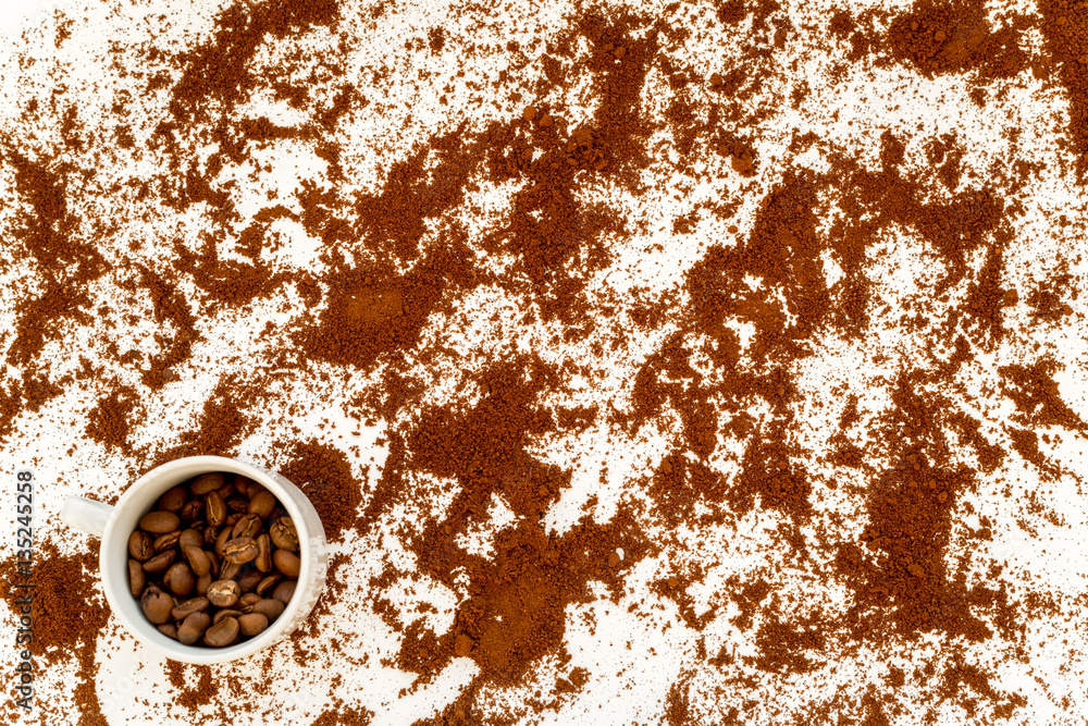 coffee beans on gray with coffe cup table top view