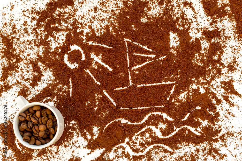 coffee beans on gray with coffe cup table top view