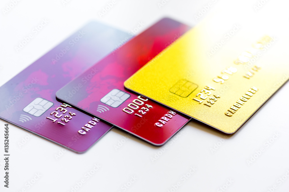 pile of credit cards on white background