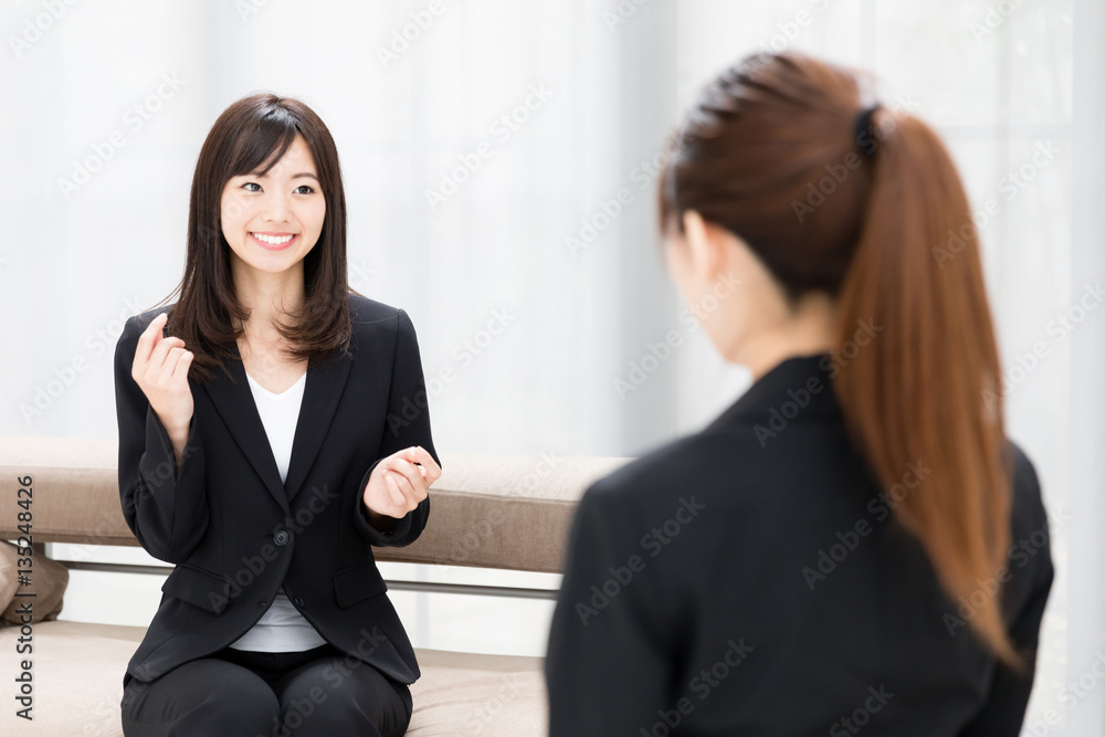 asian businesswomen talking in the office