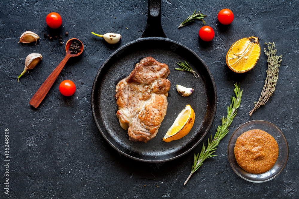 concept cooked steak on dark background top view