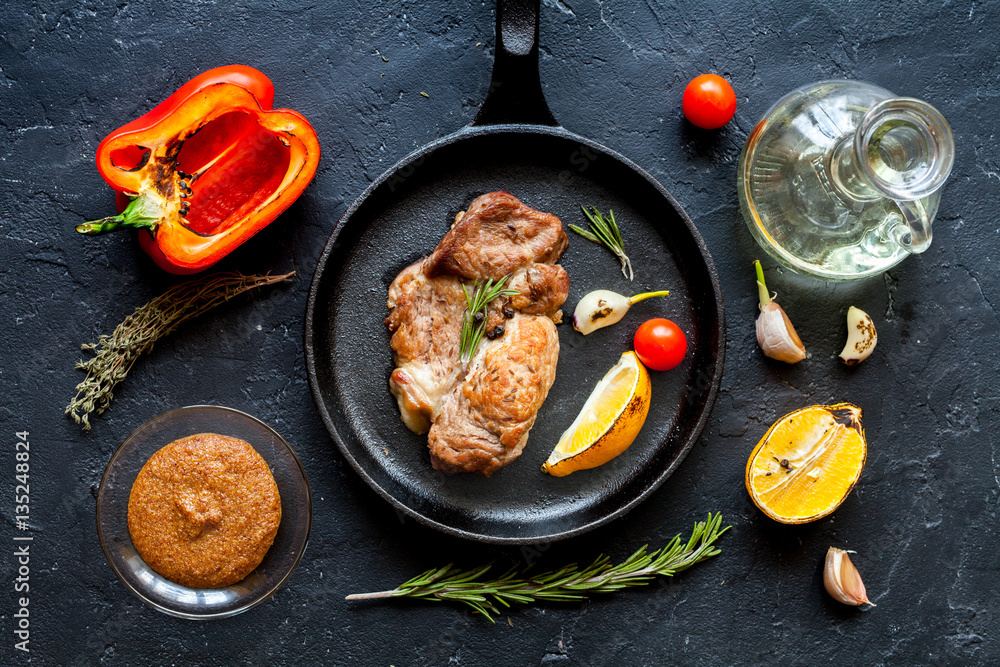 concept cooked steak on dark background top view