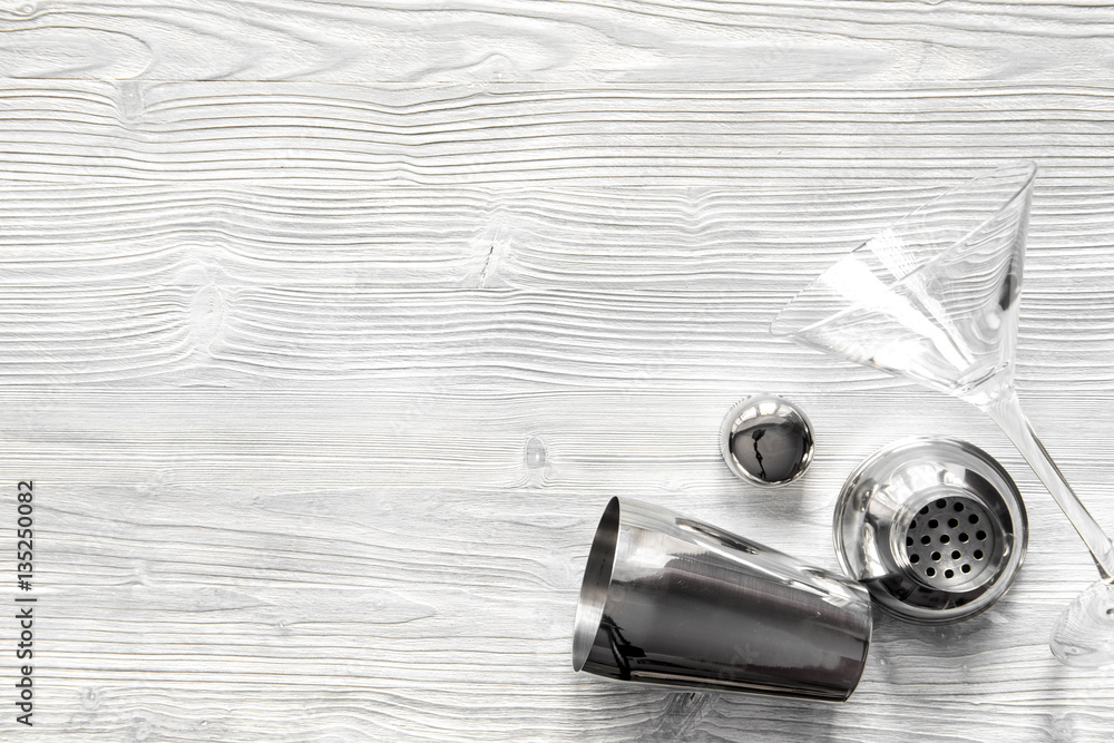 martini and shaker top view of wooden background