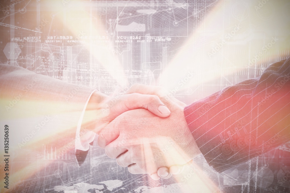 Composite image of business people shaking hands