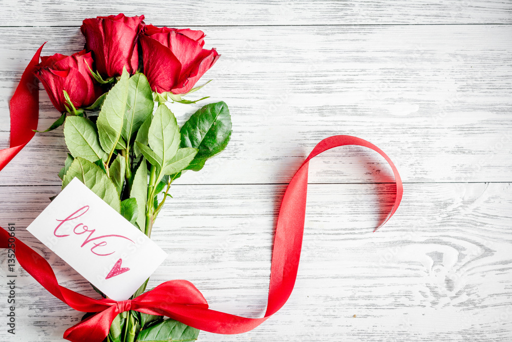 concept Valentines Day with flower wooden background top view