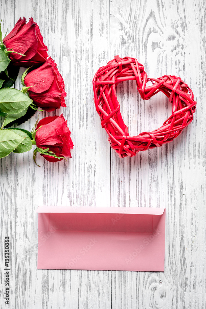 concept Valentines Day with flower wooden background top view