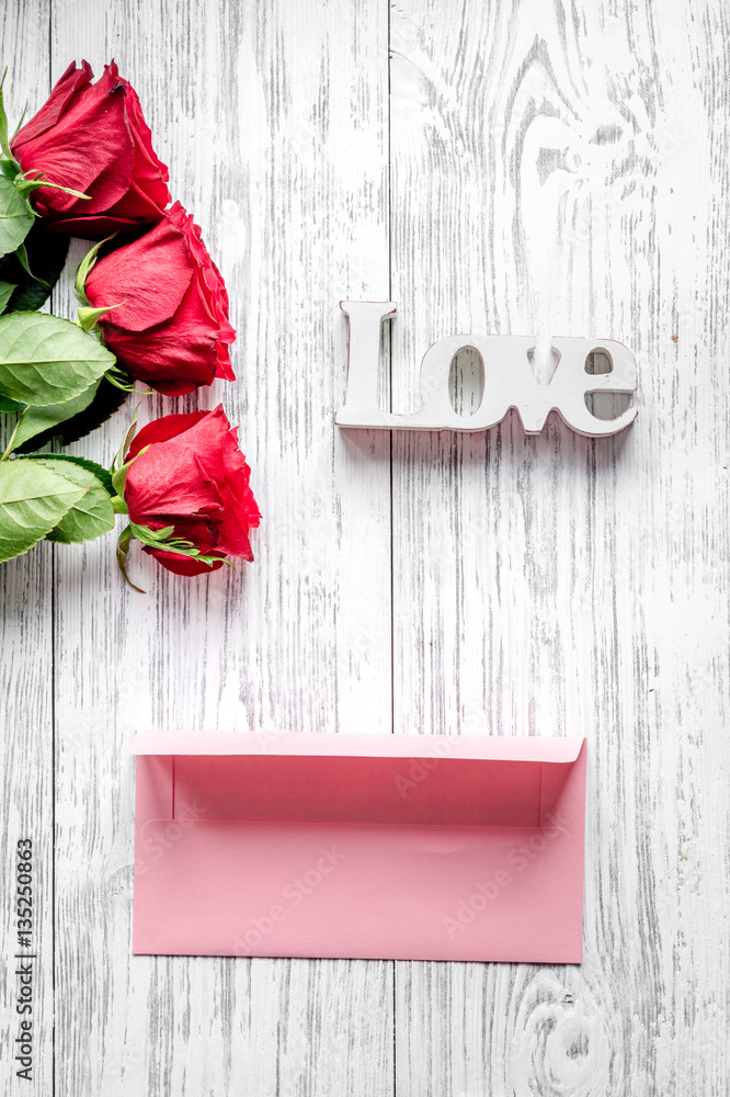 concept Valentines Day with flower wooden background top view