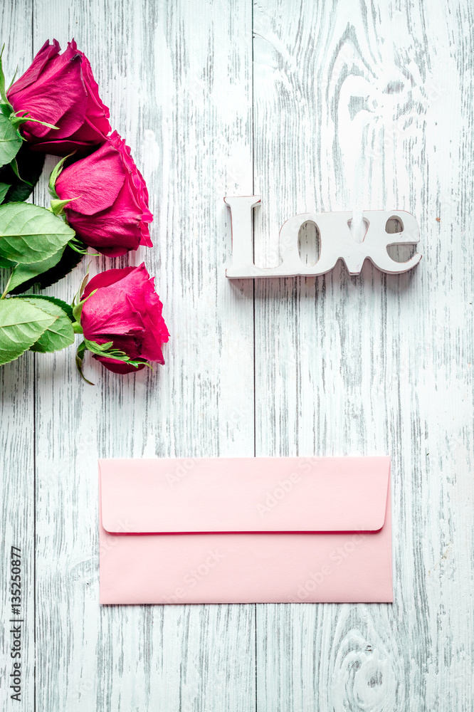 concept Valentines Day with flower wooden background top view