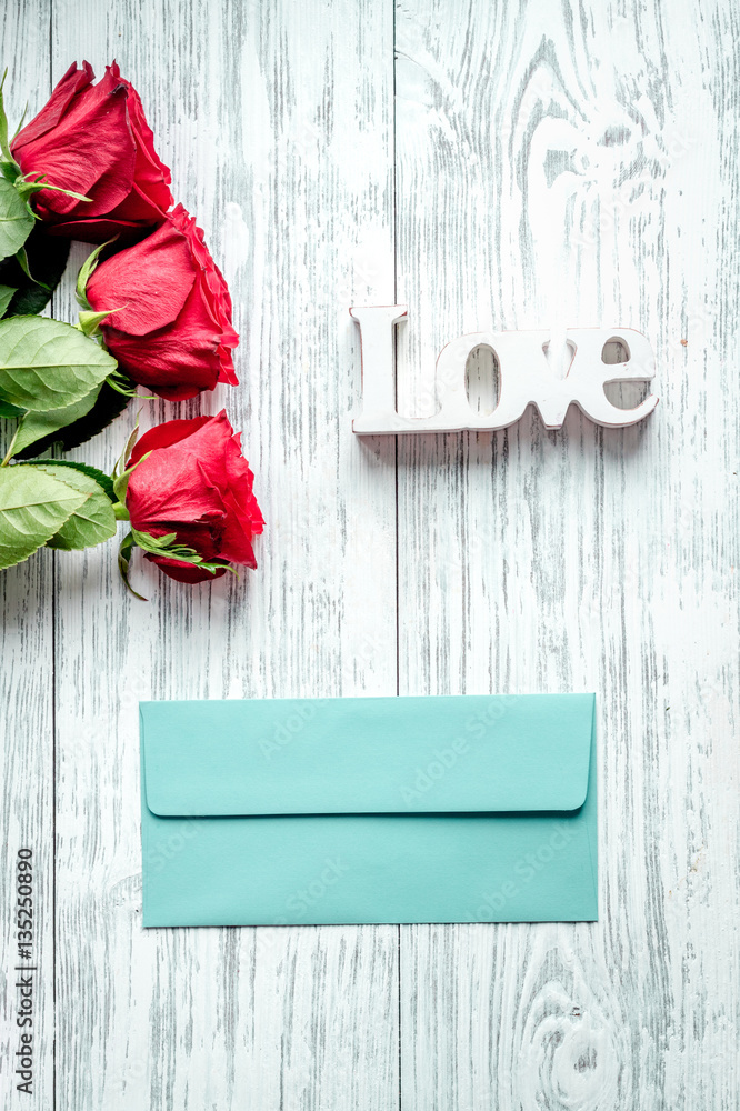 concept Valentines Day with flower wooden background top view