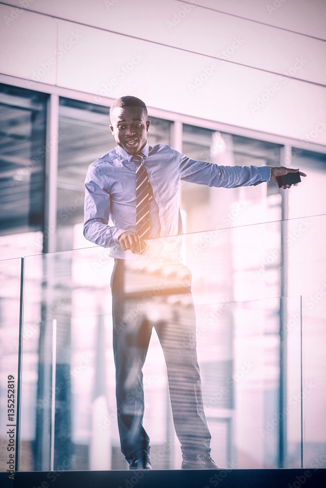 Businessman standing in hospital