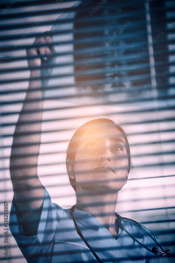 Nurse examining X-ray report