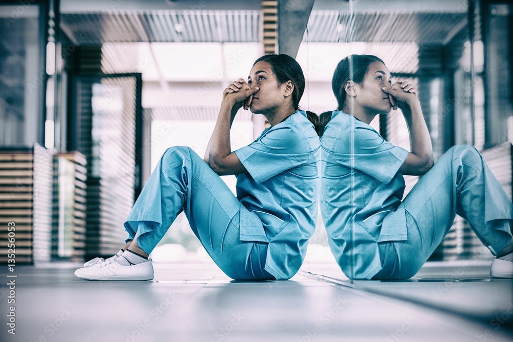 Nurse sitting on floor