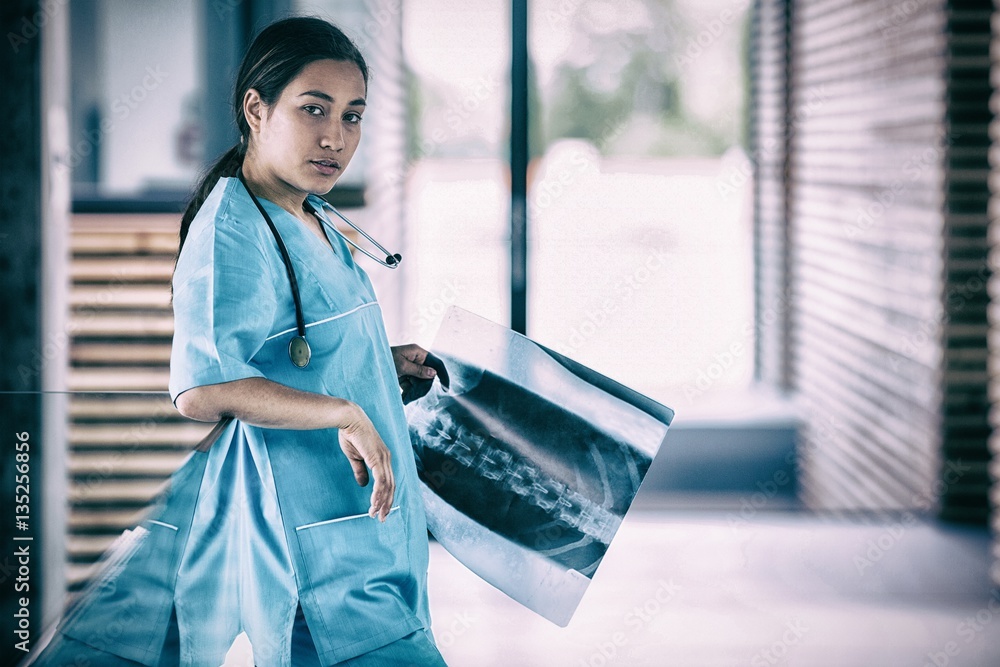 Nurse holding X-ray report